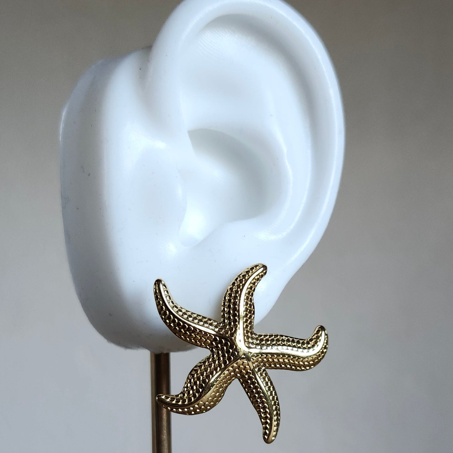 Boucle étoile de mer doré